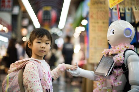 Child and Robot holding hands