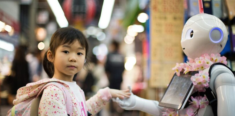 Child and Robot holding hands